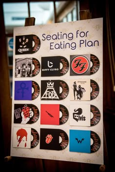 a sign with some stickers on it that says seating for eating plan and various logos