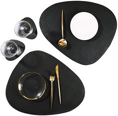 black and white place setting with gold accents