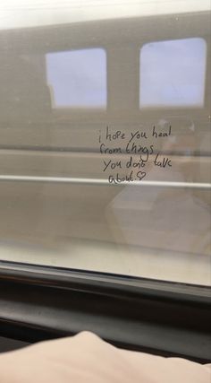 a handwritten note on the side of a train window