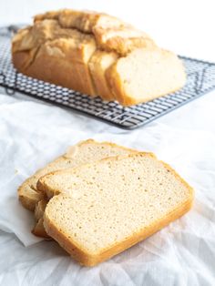 two loaves of bread sitting on top of a cooling rack