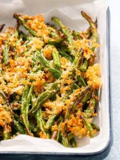 cooked green beans with parmesan cheese in a casserole dish