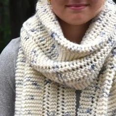 a close up of a person wearing a scarf