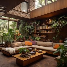 a living room filled with lots of plants and furniture