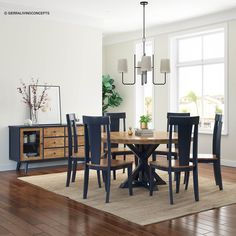 a dinning room table with chairs around it