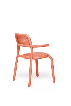 an orange plastic chair against a white background