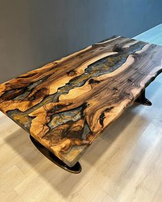 a wooden table sitting on top of a hard wood floor