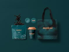 a bag, coffee cup and two bags on a green background