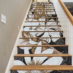 a stair case with flowers painted on it