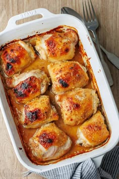 a casserole dish filled with chicken and sauce