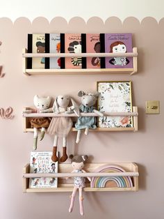 two wooden shelves filled with stuffed animals and books