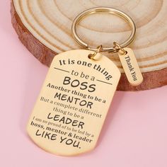 a wooden keychain with an inspirational quote on it