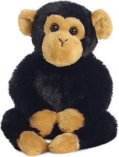 a stuffed monkey sitting on the ground