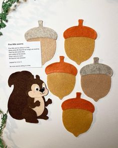 an assortment of felt acorns on display