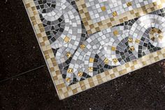 an artistic mosaic tile design on the ground