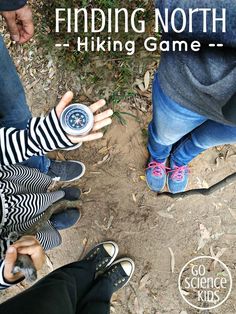 three people standing in the dirt with their hands together and text reading finding north hiking game - go science kids