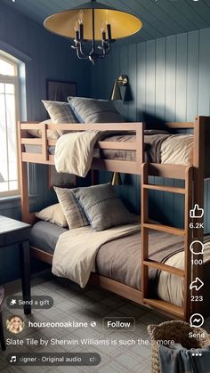 there are bunk beds in the room with pillows and blankets on top of each bed