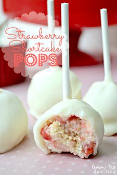 strawberry cake pops are sitting on a table