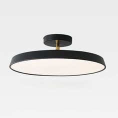 a black and gold circular light fixture