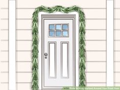 a front door decorated for christmas with greenery around the top and bottom paneling