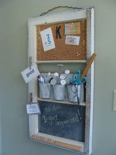 a chalkboard with magnets on it is attached to the wall