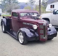 an antique truck parked in a parking lot