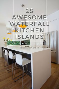 the kitchen island is surrounded by white chairs