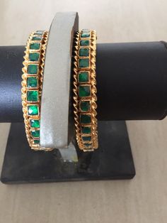 *This is Gold Finish Kundan Bangles Pair.Its Perfect for Wedding Occasion as well as Unique and Ethnic Traditional Bangle to gift and Also Bridal wear to match with Wedding Outfits. *Its made from Silver n Copper mix material and 100% Handmade. *Its available in Various Sizes like 2,2.2,2.4,2.6 Etc *Its open able Screwed Bangles Pair. *All Kundan stones set with silver foils handsetting method and long last guarantee of its workmanship.It is White Kundan Stones like pictures. *Also Available in Green Jewelry For Marriage And Festivals, Traditional Jeweled Bracelets For Parties, Wedding Jeweled Bangle, Elegant Handmade Wedding Bangle, Adjustable Temple Jewelry Bangle For Wedding, Adjustable Cutdana Party Jewelry, Green Hand Set Jewelry For Marriage, Green Bangle Bracelets For Wedding, Green Hand-set Jewelry For Marriage