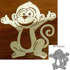 a monkey cut out on top of a wooden table