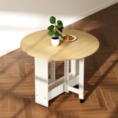 a small table with a plate of food on top of it next to a potted plant