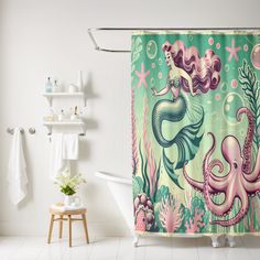 a bathroom with an octopus and mermaid shower curtain