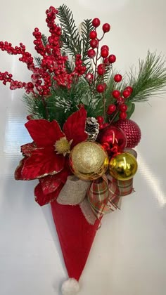 a red cone with christmas decorations and greenery