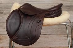 a close up of a saddle on a chair