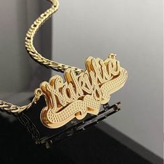 18K Gold Filled Nameplate Necklace, Custom Necklace, Double Plated Name Plate, Personalized Nameplate Necklace, Custom Jewelry Gift for Her . . . . . . . . . . . . . . . . . . . . . . . . . . . . . . . . .  * Product Description ♡ :  Introducing our exquisite 18K Gold Filled Nameplate Necklace, a stunning piece of custom jewelry that beautifully combines elegance with personalization. This Custom Necklace is the perfect gift for her, allowing you to create a meaningful and cherished accessory th Betty Boop Jewelry, Personalized Nameplate Necklace, Name Plate Necklace, Extra Long Necklace, Nameplate Necklace, Plate Necklace, Custom Necklace, Perfect Gift For Her, Protective Hairstyles