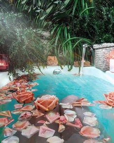 an outdoor hot tub filled with lots of shells