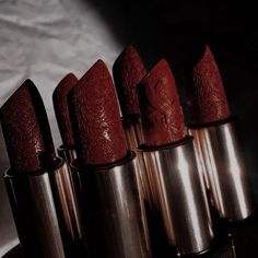 five lipsticks lined up on top of each other