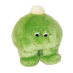 a green stuffed animal with big eyes