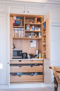 an open cupboard with many items in it