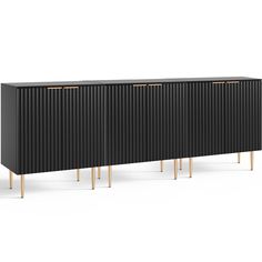 the sideboard is black and gold with three brass legs on each side, it's made out of wood