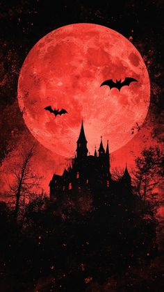 a red full moon over a castle with bats