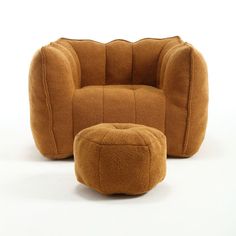 a brown chair and ottoman sitting next to each other