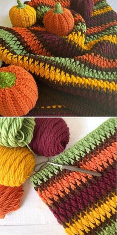 crocheted pumpkins and yarn are laying on the floor next to each other