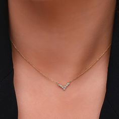 **Elevate Your Style with Our V-Shaped Diamond Chevron Necklace in 14K Gold ✨💎 Add a touch of modern sophistication to your jewelry collection with our stunning V-shaped Chevron necklace. Crafted in luxurious 14K solid gold, this exquisite piece features delicate diamonds that glisten with every move. ✨ Chic and versatile, it effortlessly enhances any outfit. ✨ Craftsmanship meets elegance in this timeless design. ✨ A symbol of strength and grace, perfect for every confident you. Indulge in the allure of gold and diamonds, and let this necklace become your signature accessory. Elevate your style to new heights with a piece that radiates beauty and charm. Make it yours today and shine brighter than ever! " ✨ Made in 14K Solid Gold 585 stamped ✨ Pendant Dimensions: 12.85mm x 7.85mm ✨ Top-qu V Necklace, Real Diamond Necklace, Necklace Everyday, Dainty Diamond Necklace, Chevron Necklace, Luxury Jewelry Brands, Gold Armband, Gold Diamond Necklace, Everyday Necklace