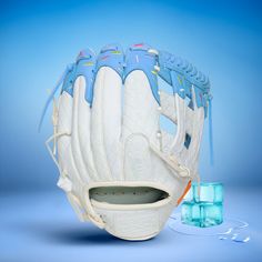 a catchers mitt and ice cubes on a blue background