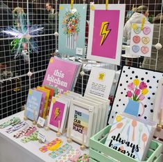 there are many cards on display at this booth, including one for the birthday girl