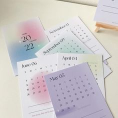 several calendars are stacked on top of each other in order to be printed out