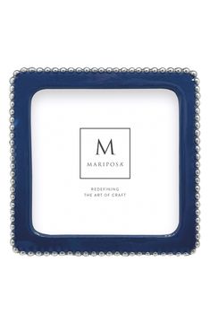 a blue frame with beaded edges and the letter m on it's side