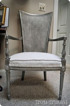 a chair sitting next to a desk in a room