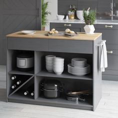 a kitchen island with plates and bowls on it