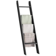 a wooden ladder with towels hanging from it's sides and two folded towels on the bottom