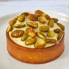 there is a cake with nuts on it